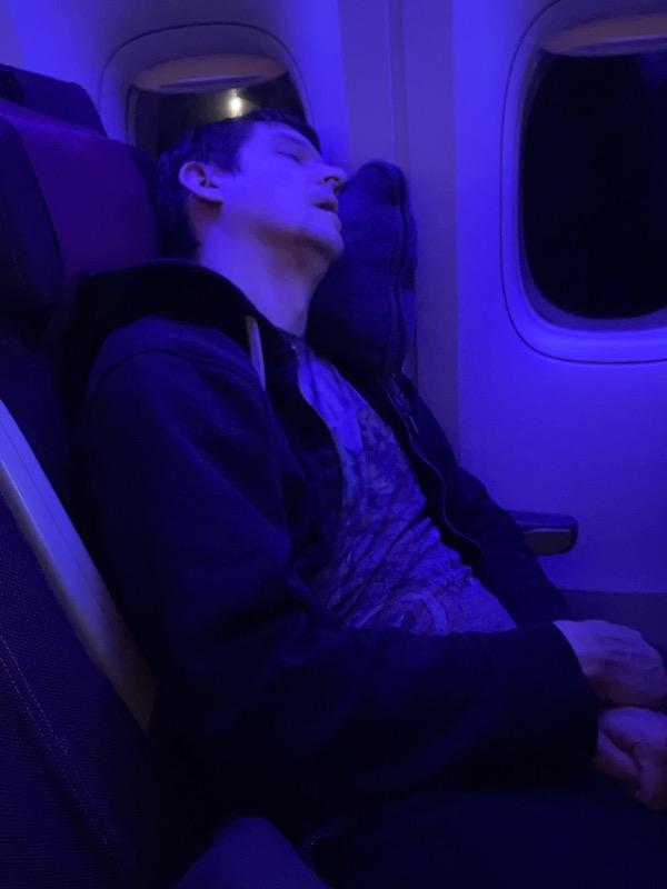 How to survive a long flight: bring a pillow and blanket!