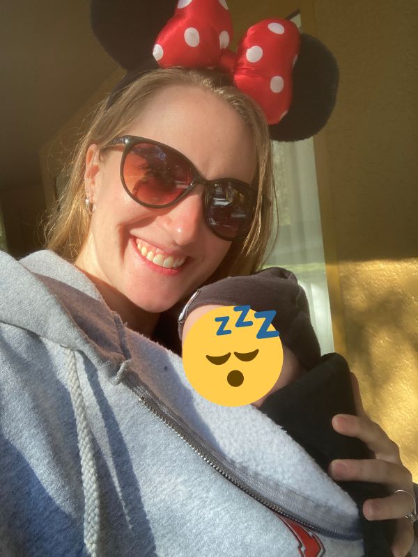 Disney with a newborn: baby sleeping in carrier
