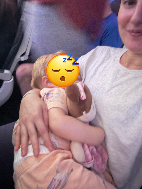 flying with a toddler under 2 - asleep on plane